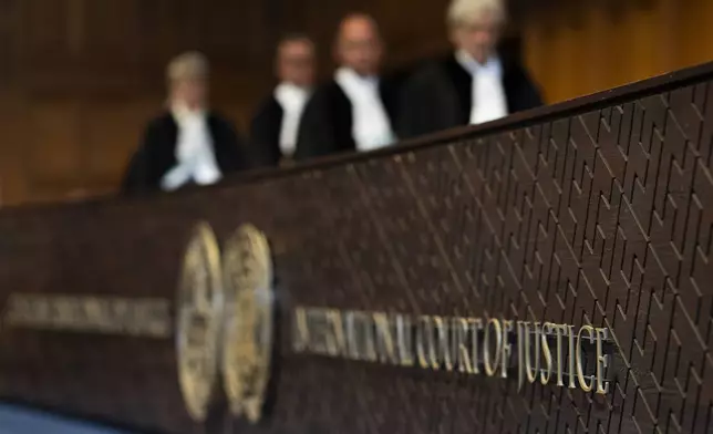 Judges enter the International Court of Justice, in The Hague, Netherlands, Thursday, May 16, 2024. The U.N.'s top court opened two days of hearings in a case brought by South Africa to see whether Israel needs to take additional measures to alleviate the suffering in war-ravaged Gaza. (AP Photo/Peter Dejong)