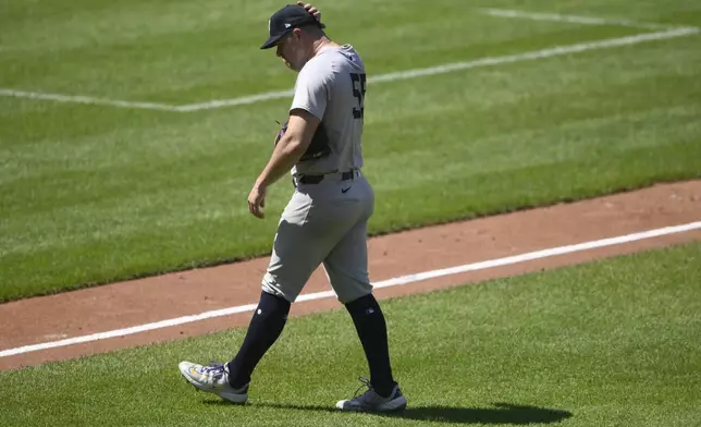 New York Yankees starting pitcher Carlos Rodon walks back to the dugout after he was pulled during the fifth inning of a baseball game against the Baltimore Orioles, Thursday, May 2, 2024, in Baltimore. (AP Photo/Nick Wass)