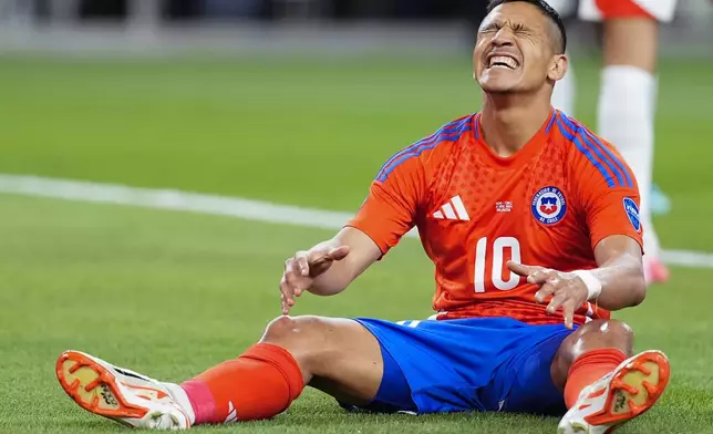 Chile's Alexis Sanchez reacts during a Copa America Group A soccer match against Peru in Arlington, Texas, Friday, June 21, 2024. (AP Photo/Julio Cortez)