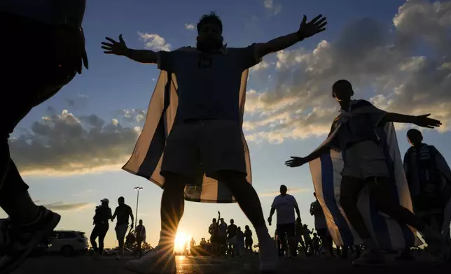 Fans of Uruguay arrive at the stadium before a Copa America Group C soccer match between Uruguay and Bolivia in East Rutherford, N.J., Thursday, June 27, 2024. (AP Photo/Julia Nikhinson)