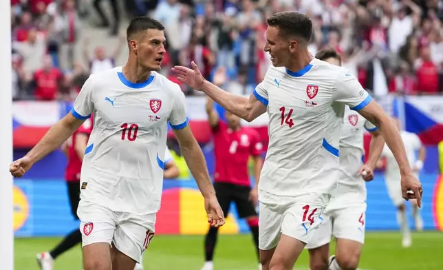 Czech Republic's Patrik Schick, left, celebrates with Czech Republic's Lukas Provod after scoring his side first goal during a Group F match between Georgia and the Czech Republic at the Euro 2024 soccer tournament in Hamburg, Germany, Saturday, June 22, 2024. (AP Photo/Ebrahim Noroozi)