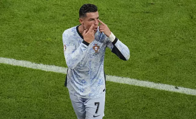 Portugal's Cristiano Ronaldo gestures as he leaves the pitch at half time during a Group F match between Georgia and Portugal at the Euro 2024 soccer tournament in Gelsenkirchen, Germany, Wednesday, June 26, 2024. (AP Photo/Andreea Alexandru)