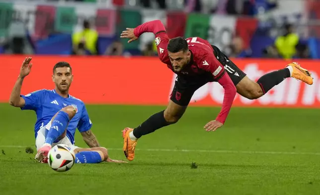 Albania's Armando Broja, right, and Italy's Lorenzo Pellegrini fight for the ball during a Group B match between Italy and Albania at the Euro 2024 soccer tournament in Dortmund, Germany, Saturday, June 15, 2024. (AP Photo/Frank Augstein)
