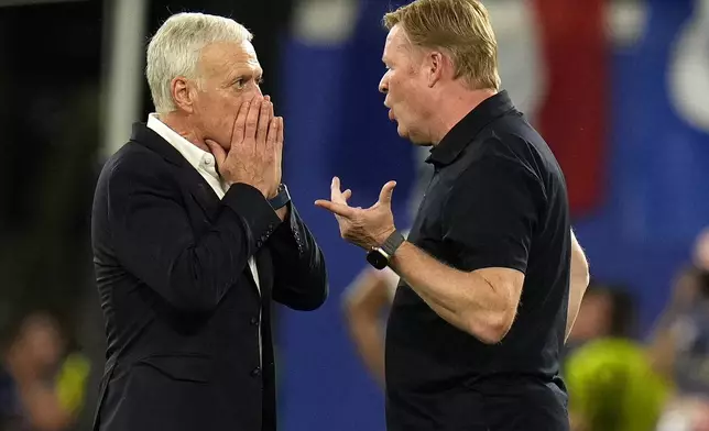 France head coach Didier Deschamps, left, and Netherlands' head coach Ronald Koeman chat after the Group D match between the Netherlands and France at the Euro 2024 soccer tournament in Leipzig, Germany, Friday, June 21, 2024. The match ended in a 0-0 draw. (AP Photo/Hassan Ammar)