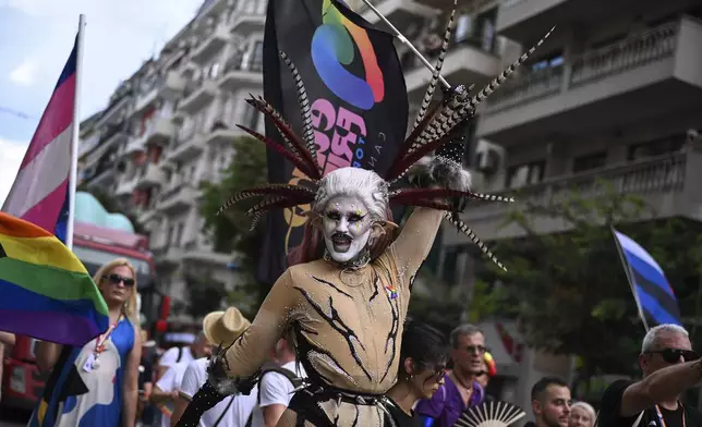 A reveller takes part in EuroPride, a pan-European international LGBTI event featuring a Pride parade which is hosted in a different European city each year, in the northern port city of Thessaloniki, Greece, Saturday, June 29, 2024. (AP Photo/Giannis Papanikos)