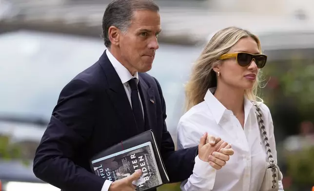 Hunter Biden, left, arrives to federal court with his wife, Melissa Cohen Biden, Thursday, June 6, 2024, in Wilmington, Del. (AP Photo/Matt Slocum)