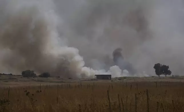 Smoke rises to the sky as a fire burns an area after a Lebanese shelling, in the Israeli-controlled Golan Heights, Thursday, June 13, 2024. (AP Photo/Leo Correa)