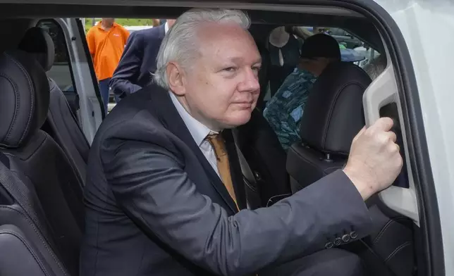 WikiLeaks founder Julian Assange leaves the federal court in Saipan, Mariana Islands, Wednesday, June 26 2024. (AP Photo/Eugene Hoshiko)