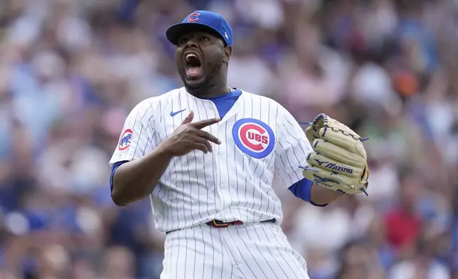 Chicago Cubs relief pitcher Héctor Neris reacts after striking out New York Mets' Jeff McNeil to end a baseball game Saturday, June 22, 2024, in Chicago. (AP Photo/Charles Rex Arbogast)