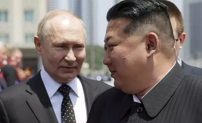 Russian President Vladimir Putin, left, and North Korea's leader Kim Jong Un attend the official welcome ceremony in the Kim Il Sung Square in Pyongyang, North Korea, on Wednesday, June 19, 2024. (Gavriil Grigorov, Sputnik, Kremlin Pool Photo via AP)