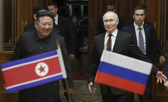 Russian President Vladimir Putin, right, and North Korea's leader Kim Jong Un smile during their meeting at the Pyongyang Sunan International Airport outside Pyongyang, North Korea, early Wednesday, June 19, 2024. (Gavriil Grigorov, Sputnik, Kremlin Pool Photo via AP)