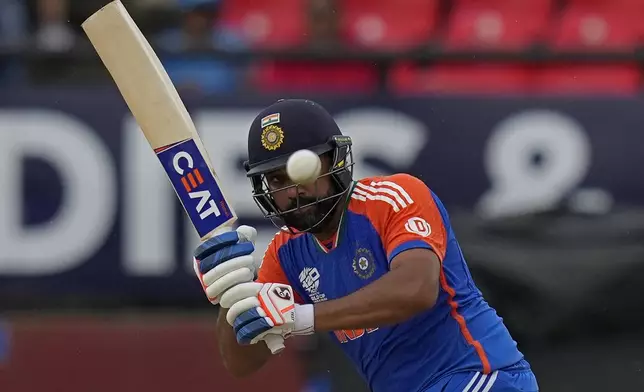 India's captain Rohit Sharma plays a shot during the ICC Men's T20 World Cup second semifinal cricket match between England and India at the Guyana National Stadium in Providence, Guyana, Thursday, June 27, 2024. (AP Photo/Ramon Espinosa)