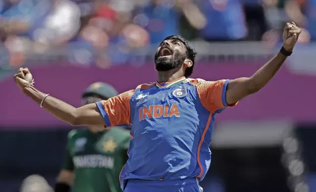 India's Jasprit Bumrah celebrates the dismissal of Pakistan's captain Babar Azam during the ICC Men's T20 World Cup cricket match between India and Pakistan at the Nassau County International Cricket Stadium in Westbury, New York, Sunday, June 9, 2024. (AP Photo/Adam Hunger)