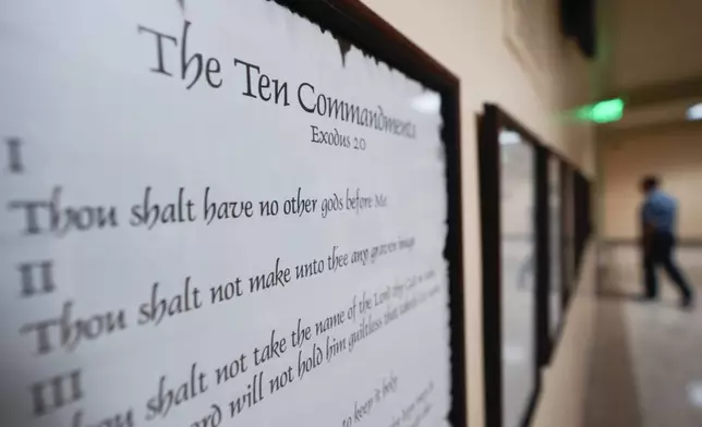 A copy of the Ten Commandments is posted along with other historical documents in a hallway at the Georgia State Capitol Building Thursday, June 20, 2024, in Atlanta. Louisiana has become the first state in the country to require the Ten Commandments are are displayed in all public schoools. (AP Photo/John Bazemore)