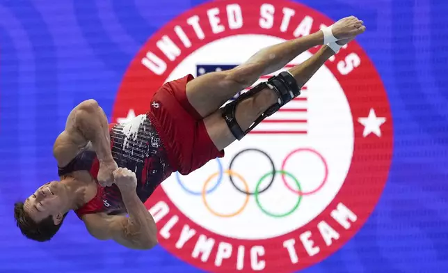Brody Malone competes in the floor exercise at the United States Gymnastics Olympic Trials on Saturday, June 29, 2024, in Minneapolis. (AP Photo/Charlie Riedel)