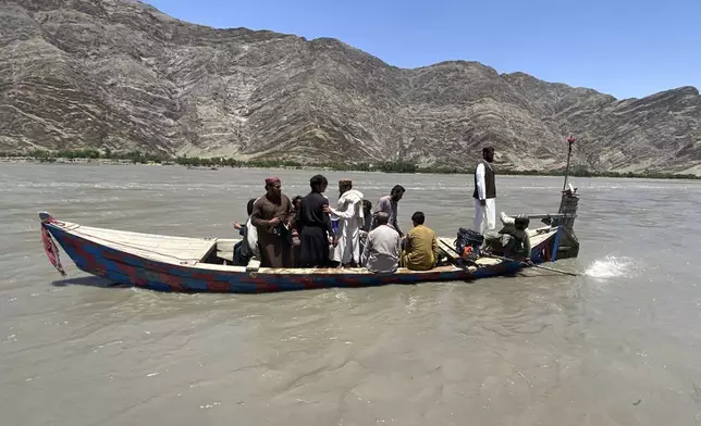 Rescuers search for survivors of sunken boat, in Mohmand Dara district of Nangarhar province east of Kabul, Afghanistan, Saturday, June 1, 2024. At least 20 people were killed when a boat sank while crossing a river in eastern Afghanistan Saturday morning, a Taliban official said. (AP Photo)