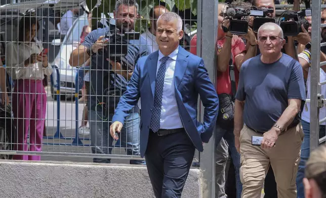 Vangjel Dule, the leader of the Unity for Human Rights Party, a party of ethnic Greek minority, left, arrives at the court in Tirana, Albania, on Tuesday, June 25, 2024. An Albanian appeals court on Tuesday upheld a two-year prison sentence for an elected mayor of the country's Greek minority, in a move expected to further exacerbate tension with neighboring Greece. The appeals court declined to change the verdict of the court of first instance in March on Dhionisios Alfred Beleris, 51, who was imprisoned on charges of vote-buying in municipal elections last year. (AP Photo/Vlasov Sulaj)