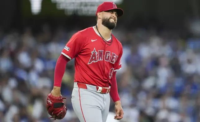 Los Angeles Angels starting pitcher Patrick Sandoval (43) reacts after an injury during the third inning of a baseball game against the Los Angeles Dodgers in Los Angeles, Friday, June 21, 2024. (AP Photo/Ashley Landis)