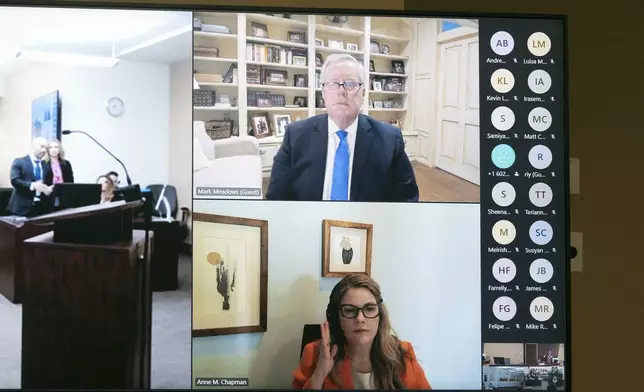 Mark Meadows, top center, former Chief of Staff to President Donald Trump, and his attorney, Anne Chapman, bottom center, appear via video during his arraignment in Maricopa County Superior Court, Friday, June 7, 2024, in Phoenix. Meadows pleaded not guilty Friday to nine felony charges for his role in an effort to overturn Trump's Arizona election loss to Joe Biden. (Mark Henle/The Arizona Republic via AP)