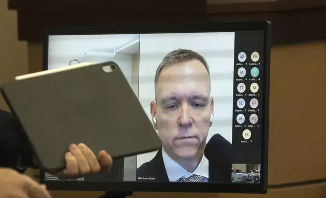 Trump 2020 Election Day operations director Michael Roman appears via video during his arraignment in Maricopa County Superior Court, Friday, June 7, 2024, in Phoenix. Roman pleaded not guilty Friday to nine felony charges for his role in an effort to overturn Trump's Arizona election loss to Joe Biden. (Mark Henle/The Arizona Republic via AP)