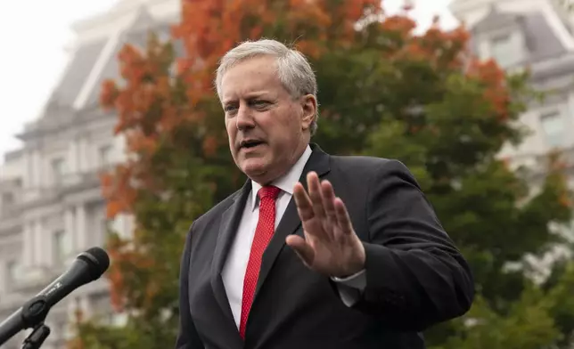 FILE - White House former chief of staff Mark Meadows speaks with reporters at the White House, Wednesday, Oct. 21, 2020, in Washington. Meadows appeared by videoconference, Friday, June 7, 2024, in Phoenix, pleading not guilty to nine felony charges stemming from their roles in an effort to overturn Trump's election loss in Arizona to Joe Biden. (AP Photo/Alex Brandon, File)