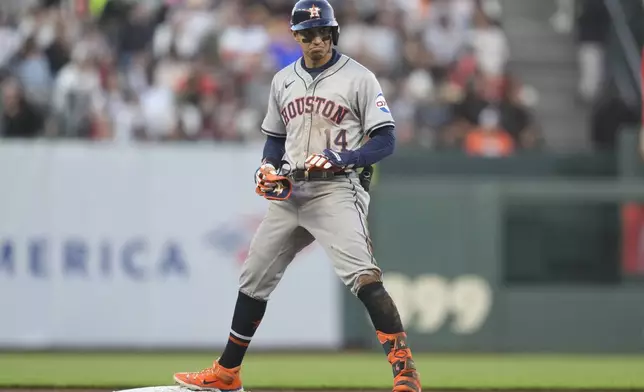 Houston Astros' Mauricio Dubón reacts after hitting a double against the San Francisco Giants during the fifth inning of a baseball game in San Francisco, Tuesday, June 11, 2024. (AP Photo/Jeff Chiu)