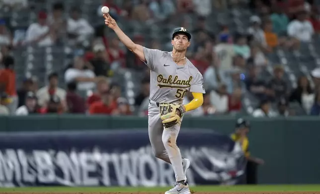 Oakland Athletics third baseman Armando Alvarez throws out Los Angeles Angels' Luis Rengifo at first during the seventh inning of a baseball game Tuesday, June 25, 2024, in Anaheim, Calif. (AP Photo/Ryan Sun)