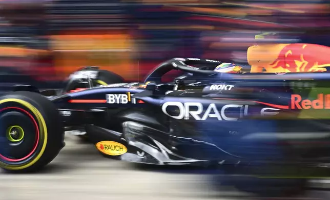 Red Bull driver Sergio Perez of Mexico steers his car during the Austrian Formula One Grand Prix race at the Red Bull Ring racetrack in Spielberg, Austria, Sunday, June 30, 2024. (AP Photo/Christian Bruna, Pool)