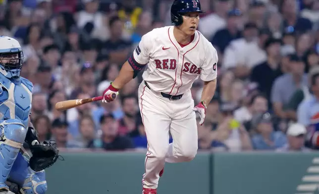 Boston Red Sox designated hitter Masataka Yoshida watches the flight of his single during the fifth inning of a baseball game against the Toronto Blue Jays at Fenway Park, Monday, June 24, 2024, in Boston. (AP Photo/Charles Krupa)