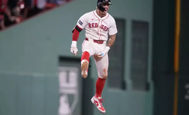 Boston Red Sox's Jarren Duran celebrates after his walk-off RBI single in the bottom of the ninth inning of a baseball game against the Toronto Blue Jays at Fenway Park, Monday, June 24, 2024, in Boston. (AP Photo/Charles Krupa)