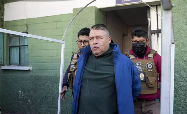 Juan Jose Zuniga, former commanding general of the Army, is escorted from a jail to be taken to Chonchocoro maximum security prison, in La Paz, Bolivia, Saturday, June 29, 2024. Zuniga was detained for his involvement in what President Luis Arce called a coup attempt. (AP Photo/Juan Karita)