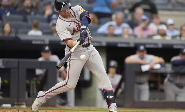 Atlanta Braves' Austin Riley hits a home run against the New York Yankees during the first inning of a baseball game Friday, June 21, 2024, in New York. (AP Photo/Frank Franklin II)