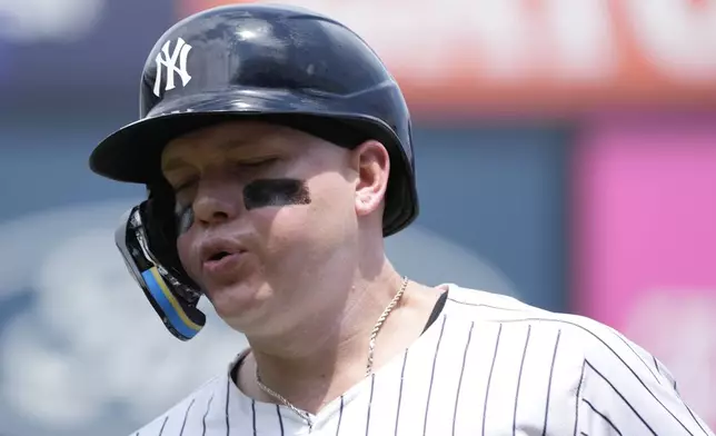 New York Yankees' Alex Verdugo runs into the dugout at the bottom of the first inning after grounding out to Atlanta Braves first baseman Matt Olson during a baseball game, Sunday, June 23, 2024, in New York. (AP Photo/Pamela Smith)