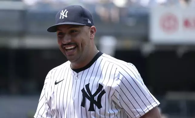 New York Yankees' Nestor Cortes smiles after striking out all batters during the first inning of a baseball game against the Atlanta Braves, Sunday, June 23, 2024, in New York. (AP Photo/Pamela Smith)