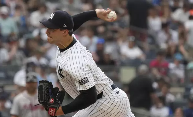 New York Yankees' Tommy Kahnle pitches during the eighth inning of a baseball game against the Atlanta Braves, Sunday, June 23, 2024, in New York. (AP Photo/Pamela Smith)