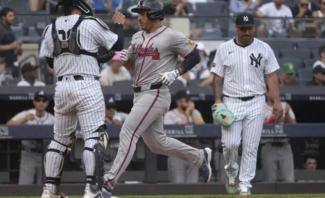 Atlanta Braves' Orlando Arcia scores on a single hit by Ozzie Albies during the fifth inning of a baseball game against the New York Yankees, Sunday, June 23, 2024, in New York. (AP Photo/Pamela Smith)