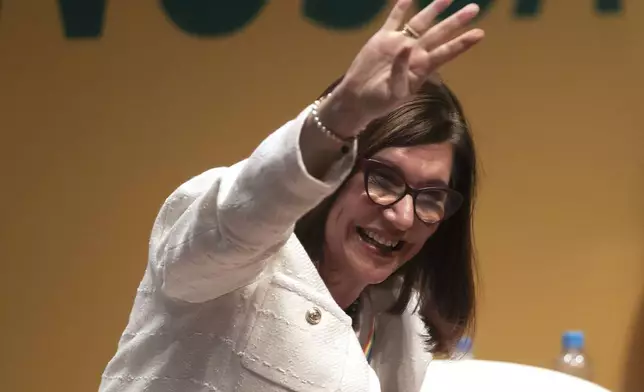 Magda Chambriard, the new president of the state-run oil company Petrobras, waves during her inauguration ceremony, in Rio de Janeiro, Brazil, Wednesday, June 19, 2024. (AP Photo/Bruna Prado)