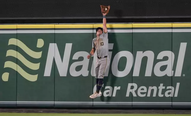 Milwaukee Brewers center fielder Sal Frelick catches a fly ball hit by Los Angeles Angels' Taylor Ward for the final out of a baseball game Tuesday, June 18, 2024, in Anaheim, Calif. (AP Photo/Ryan Sun)