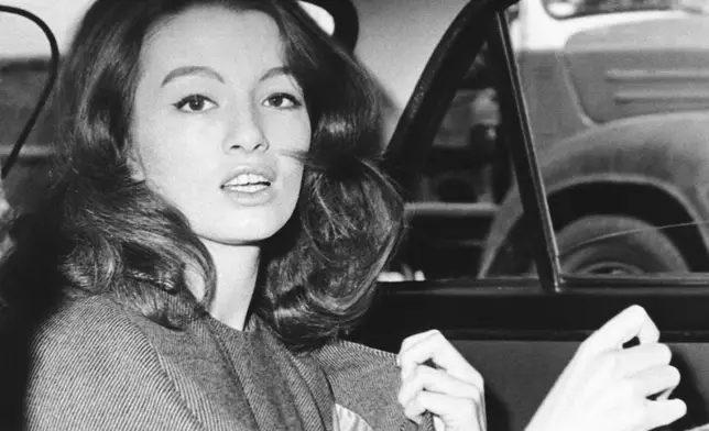 FILE - Christine Keeler, photographed in London in 1963. Britain’s upcoming general election on July 4, 2024, is widely expected to lead to a change of government for the first time in 14 years. In 1964, the Conservative Party had been in power for 13 years and was on its fourth prime minister. A sex scandal rocked the Conservative government and the British establishment, adding to the general feeling that the party had lost touch. Minister for war, John Profumo, resigned for lying to Parliament over his affair with model and show girl Christine Keeler. (AP Photo/File)