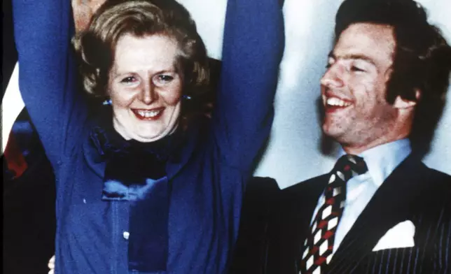 FILE - Britain's Margaret Thatcher waves in celebration at Conservative Party headquarters in London in the early hours of May 4, 1979, after winning the General Election. At right is her son Mark. Britain’s upcoming general election on July 4, 2024, is widely expected to lead to a change of government for the first time in 14 years. Britain's general election in 1979 is without doubt the most consequential since 1945, with Margaret Thatcher becoming the country’s first female prime minister on a radical Conservative economic agenda. At its heart, Thatcherism represented a total rethink over the role of the state. (AP Photo/Bob Dear, File)