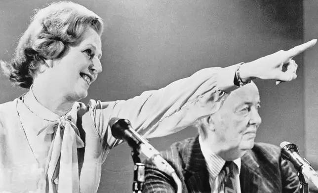 FILE - Britain's Conservative party leader Margaret Thatcher raises her arm and points, while answering questions at a press conference in London, April 11, 1979, launching her party's policies for the General Election. Britain’s upcoming general election on July 4, 2024, is widely expected to lead to a change of government for the first time in 14 years. Britain's general election in 1979 is without doubt the most consequential since 1945, with Margaret Thatcher becoming the country’s first female prime minister on a radical Conservative economic agenda. At its heart, Thatcherism represented a total rethink over the role of the state. (AP Photo/Lawrence Harris, File)