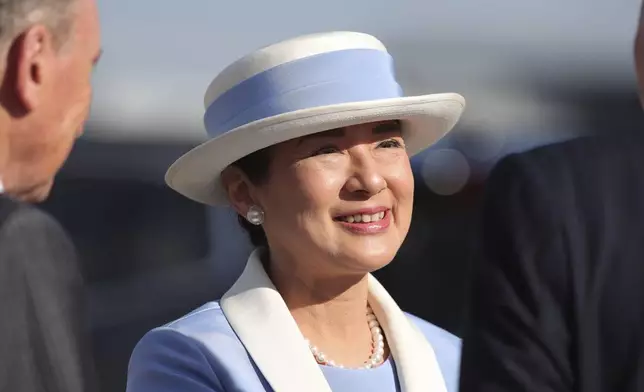 Japan Empress Masako smiles as she disembarks at Stansted Airport, England, Saturday, June 22, 2024, ahead of a state visit. The state visit begins Tuesday, when King Charles III and Queen Camilla will formally welcome the Emperor and Empress before taking a ceremonial carriage ride to Buckingham Palace. (Chris Radurn/PA via AP)