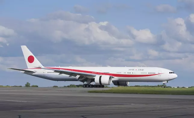 The plane carrying Emperor Naruhito and Empress Masako arrives at Stansted Airport, England, Saturday, June 22, 2024, ahead of a state visit. The state visit begins Tuesday, when King Charles III and Queen Camilla will formally welcome the Emperor and Empress before taking a ceremonial carriage ride to Buckingham Palace. (AP Photo/Kin Cheung)