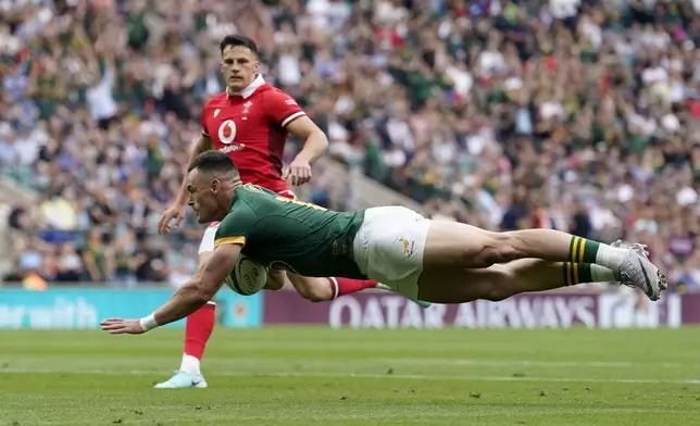 South Africa's Jesse Kriel scores a try during the rugby union cup match between Wales and South Africa at Twickenham Stadium, London, Saturday June 22, 2024. (Andrew Matthews/PA via AP)