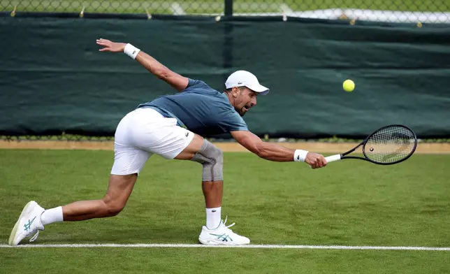Novak Djokovic during a training session at the All England Lawn Tennis and Croquet Club in Wimbledon ahead of the Wimbledon Championships, which begins on July 1st, on Tuesday June 25, 2024. (John Walton/PA via AP)