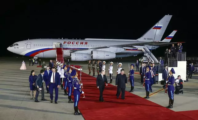 CORRECTS DATE TO EARLY WEDNESDAY, JUNE 19 - Russian President Vladimir Putin, center left, and North Korea's leader Kim Jong Un, center right, walk together during their meeting at the Pyongyang Sunan International Airport outside Pyongyang, North Korea, early Wednesday, June 19, 2024. (Vladimir Smirnov, Sputnik, Kremlin Pool Photo via AP)