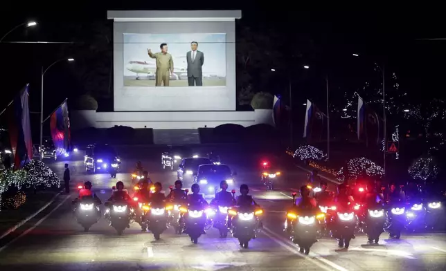 CORRECTS DATE TO EARLY WEDNESDAY, JUNE 19 - A motorcade with Russian President Vladimir Putin and North Korea's leader Kim Jong Un rolls from the Pyongyang Sunan International Airport outside Pyongyang, North Korea, early Wednesday, June 19, 2024. (Gavriil Grigorov, Sputnik, Kremlin Pool Photo via AP)