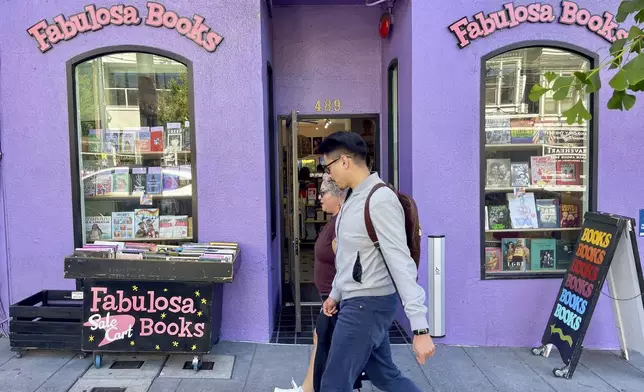 Pedestrians walk past the Fabulosa Books store in San Francisco's Castro District on Thursday, June 27, 2024. The bookstore is sending LGBTQ+ books to parts of the country where they are censored to counter the rapidly growing effort by anti-LGBTQ+ activists and lawmakers to ban queer-friendly books from public schools and libraries. (AP Photo/Haven Daley)