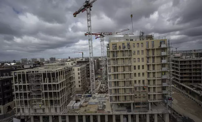 FILE - The Olympic athletes' village is under construction during a press tour in Saint Denis, outside Paris, March 24, 2023. (AP Photo/Aurelien Morissard, File)