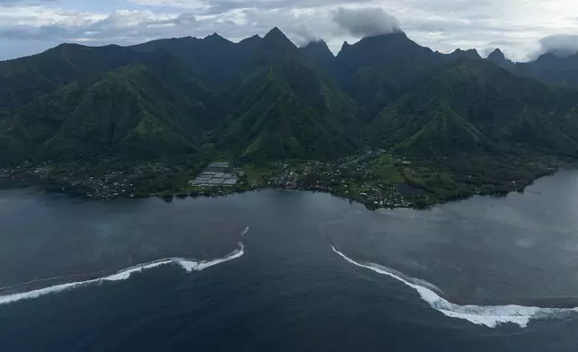 The surf breaks onto the lagoon in Teahupo'o, Tahiti, French Polynesia, Wednesday, Jan. 17, 2024. Teahupo'o will host the surfing competitions during the Olympic Games. (AP Photo/Daniel Cole)